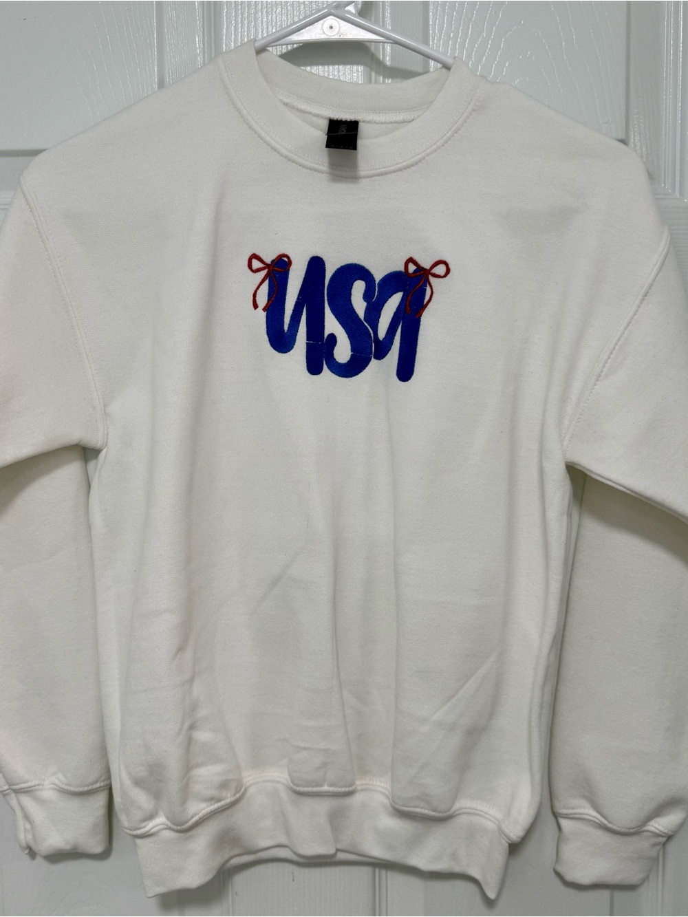 Gildan White Crewneck Sweater with Blue USA Embroidery and Red Bow Accents